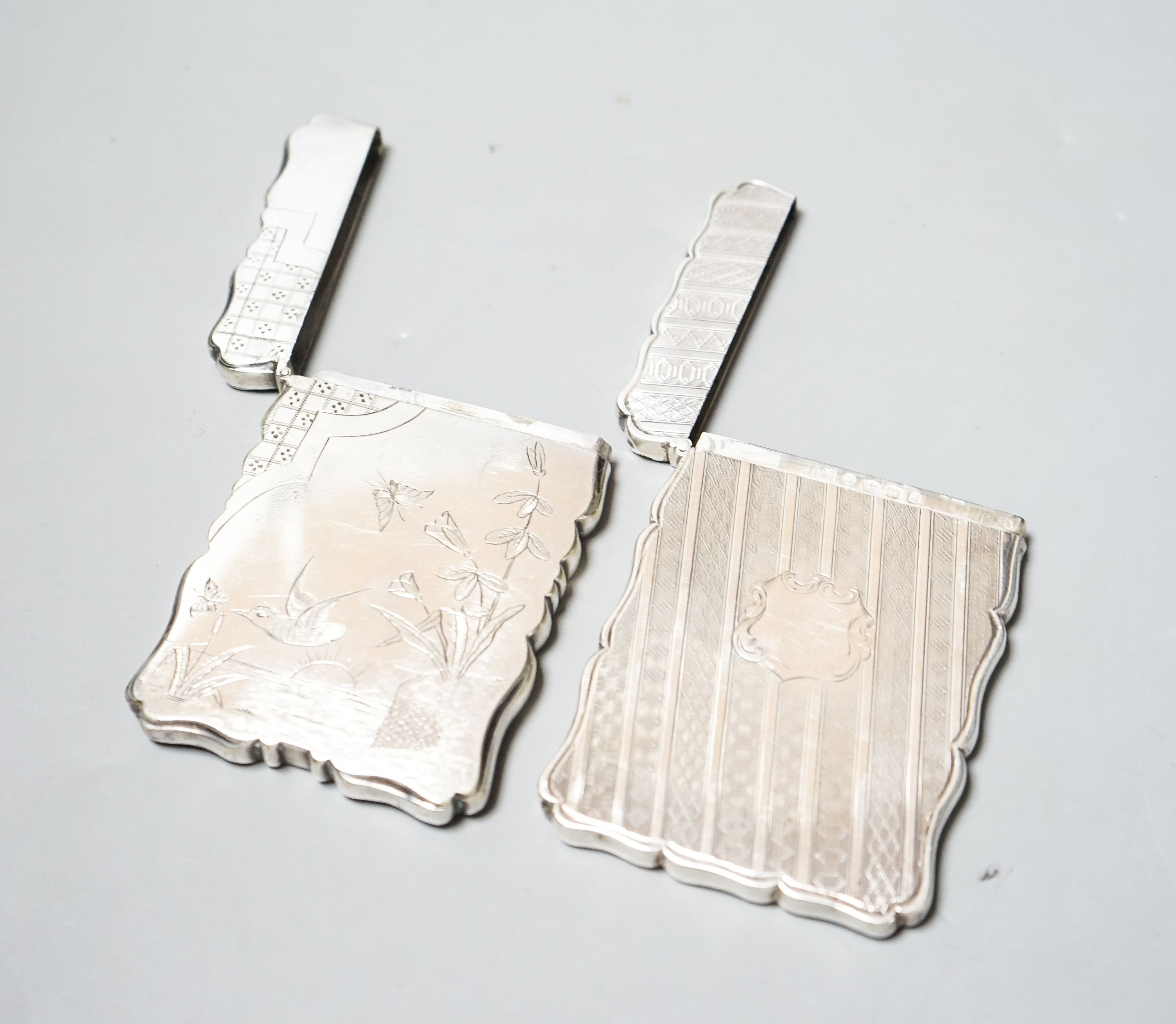 A Victorian engraved silver card case, Edward Smith, Birmingham, 1865, 9.8cm and a silver plated card case with engraved aesthetic decoration.